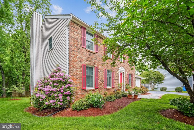 14616 Orangewood St, Silver Spring, MD 20905 - view of front of property with a chimney, brick siding, and a garage