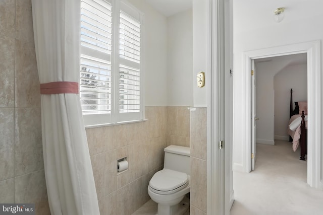 1022 S Beechfield Ave, Baltimore, MD 21229 - bathroom with toilet and tile walls
