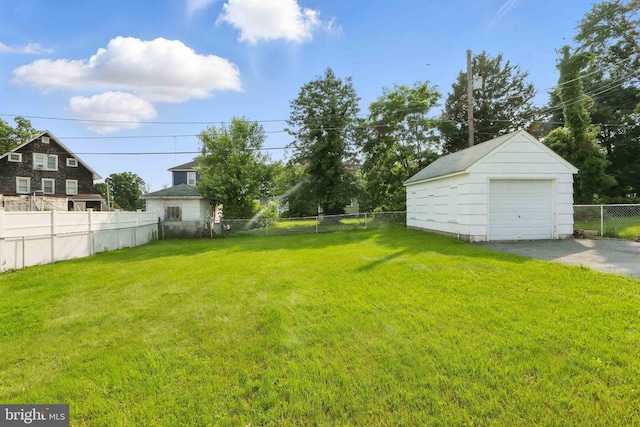1022 S Beechfield Ave, Baltimore, MD 21229 - view of yard with a detached garage, an outdoor structure, and driveway