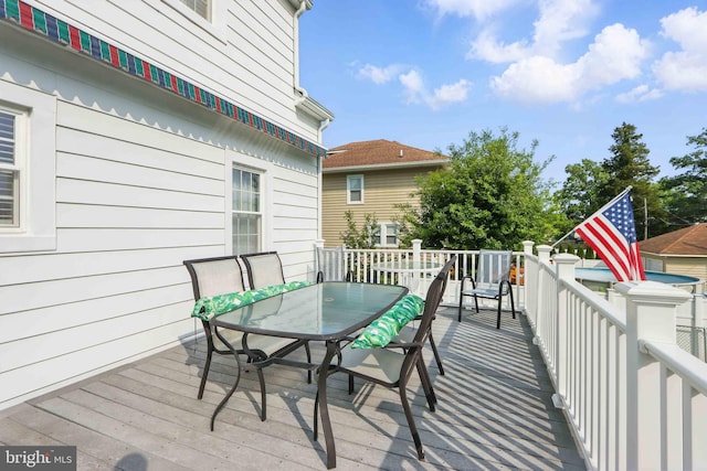 1022 S Beechfield Ave, Baltimore, MD 21229 - wooden terrace with outdoor dining area