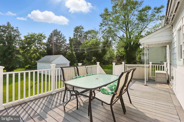 1022 S Beechfield Ave, Baltimore, MD 21229 - wooden deck featuring a lawn, an outbuilding, and outdoor dining space