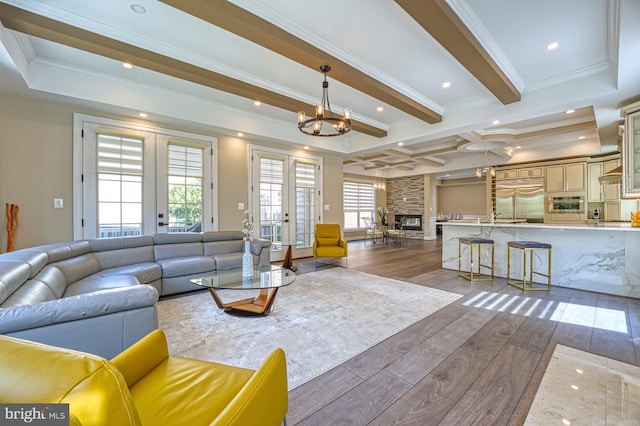 1600 Great Falls St, Mclean, VA 22101 - living area with crown molding, a chandelier, beam ceiling, wood finished floors, and french doors