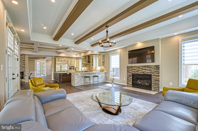 1600 Great Falls St, Mclean, VA 22101 - living room with dark wood-style flooring, beamed ceiling, recessed lighting, ornamental molding, and a stone fireplace