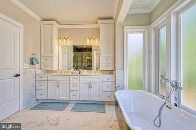 1600 Great Falls St, Mclean, VA 22101 - bathroom with ornamental molding, double vanity, a soaking tub, a shower stall, and marble finish floors