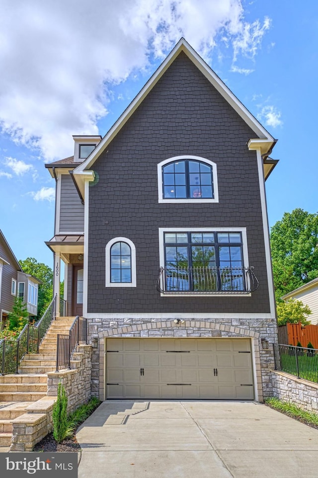 1600 Great Falls St, Mclean, VA 22101 - view of front of property featuring an attached garage, concrete driveway, stairs, and stone siding