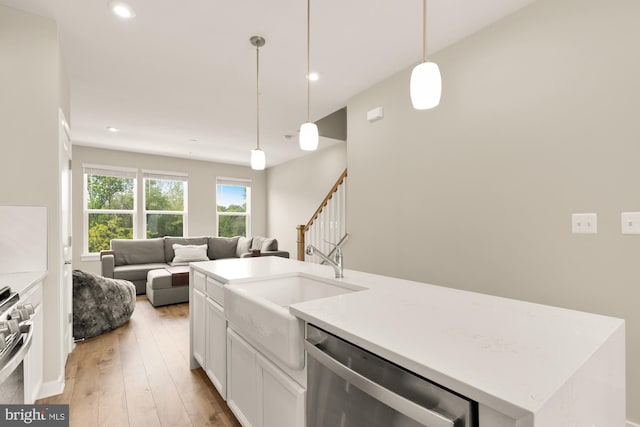 2521 River Terrace Rd, Hyattsville, MD 20782 - kitchen featuring appliances with stainless steel finishes, open floor plan, a sink, recessed lighting, and white cabinetry
