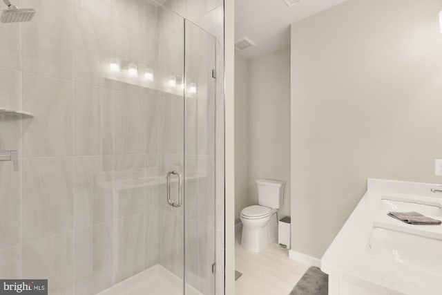 2521 River Terrace Rd, Hyattsville, MD 20782 - bathroom with a stall shower, toilet, double vanity, and baseboards