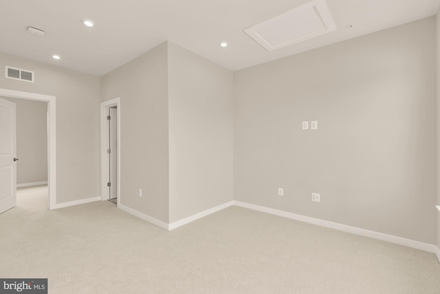 2521 River Terrace Rd, Hyattsville, MD 20782 - spare room featuring light colored carpet, baseboards, recessed lighting, and attic access