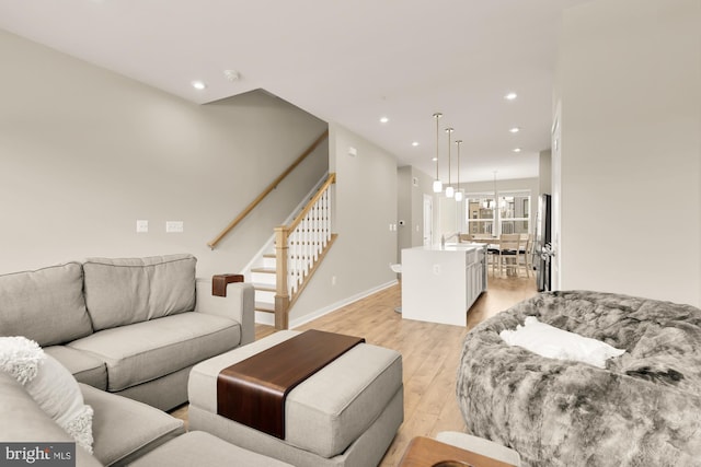 2521 River Terrace Rd, Hyattsville, MD 20782 - living room featuring light wood-type flooring, stairs, recessed lighting, and baseboards