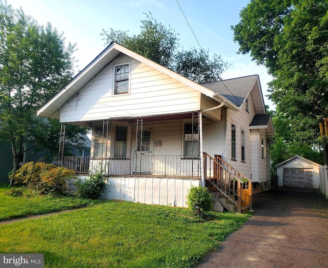 260 Weber Ave, Ewing, NJ 08638 - bungalow-style house with covered porch, driveway, an outbuilding, a detached garage, and a front yard