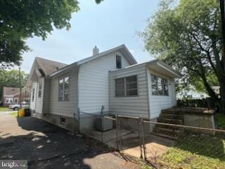 260 Weber Ave, Ewing, NJ 08638 - view of property exterior with a chimney