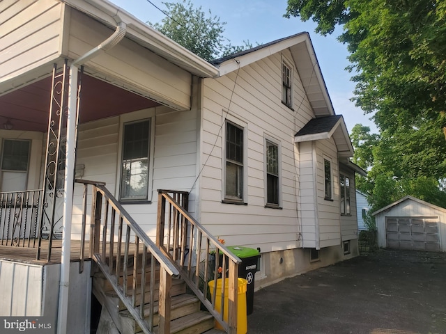 260 Weber Ave, Ewing, NJ 08638 - view of side of property with a garage, an outdoor structure, and asphalt driveway
