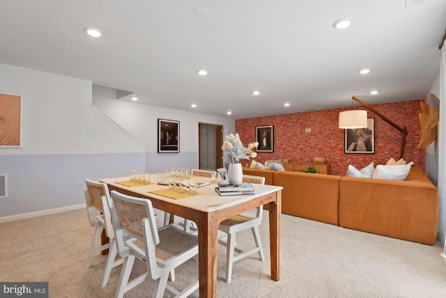 453 Ensemble Way, Frederick, MD 21701 - dining area with light carpet, brick wall, recessed lighting, and baseboards
