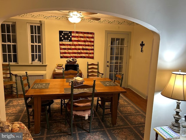 129 Redwood Ave, Trenton, NJ 08619 - dining area with arched walkways, ceiling fan, and wood finished floors