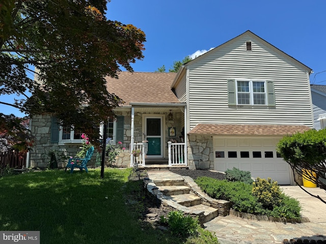 129 Redwood Ave, Trenton, NJ 08619 - tri-level home with stone siding, roof with shingles, a garage, a front lawn, and concrete driveway