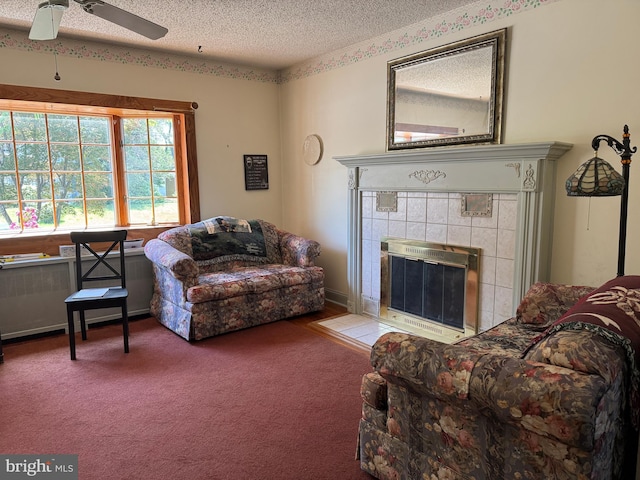 129 Redwood Ave, Trenton, NJ 08619 - living room featuring a textured ceiling, carpet, ceiling fan, and a fireplace