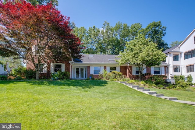 1440 Highwood Dr, Mclean, VA 22101 - view of front of house featuring brick siding, french doors, and a front yard