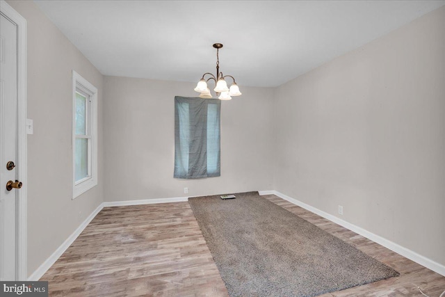 70 Steinfeld Ave, Pittsgrove, NJ 08318 - unfurnished room with wood finished floors and a chandelier