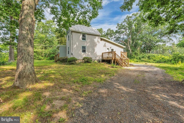 70 Steinfeld Ave, Pittsgrove, NJ 08318 - back of house with a deck, stairs, driveway, and a metal roof