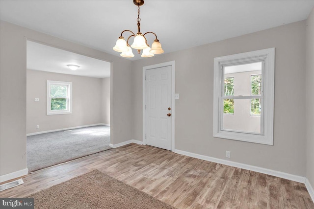 70 Steinfeld Ave, Pittsgrove, NJ 08318 - entryway featuring wood finished floors and a chandelier