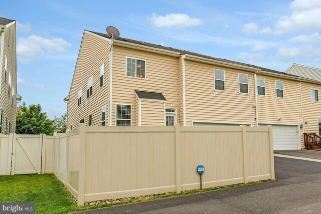 41706 Deer Grass Ter, Aldie, VA 20105 - view of property exterior featuring a garage and asphalt driveway