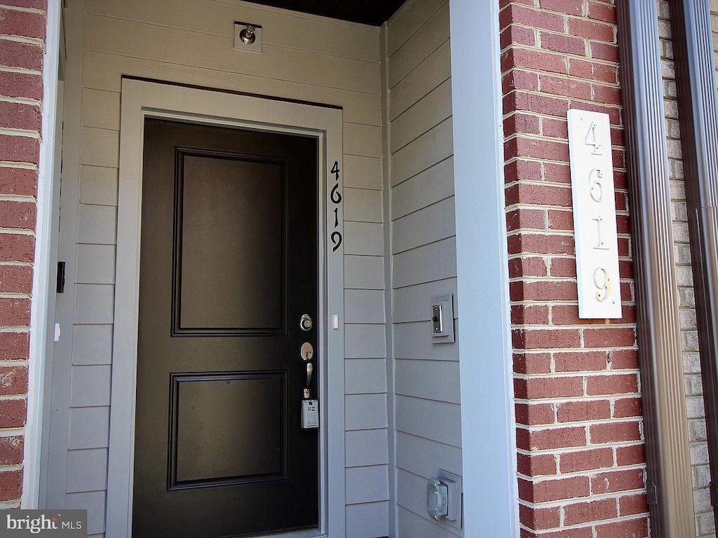 4619 Olivine Dr, Chantilly, VA 20151 - doorway to property with brick siding