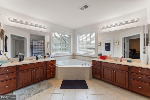 14207 Pollin St, Accokeek, MD 20607 - bathroom with tile patterned flooring, a whirlpool tub, two vanities, and a shower with shower curtain