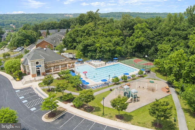 14207 Pollin St, Accokeek, MD 20607 - drone / aerial view of a pool area and a heavily wooded area