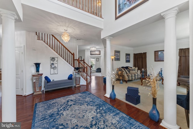 14207 Pollin St, Accokeek, MD 20607 - foyer featuring stairway, wood finished floors, crown molding, decorative columns, and a towering ceiling