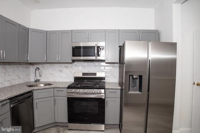 1626 N 30th St, Philadelphia, PA 19121 - kitchen featuring appliances with stainless steel finishes, gray cabinets, and a sink
