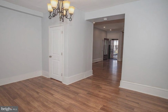 1626 N 30th St, Philadelphia, PA 19121 - unfurnished dining area with a chandelier, wood finished floors, and baseboards