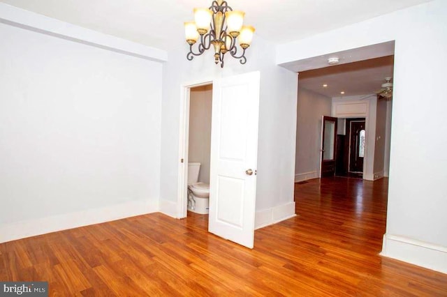 1626 N 30th St, Philadelphia, PA 19121 - spare room featuring a chandelier, wood finished floors, baseboards, and a smoke detector
