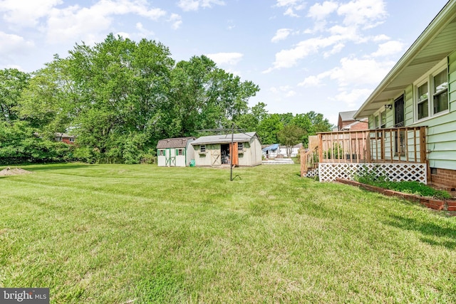 5915 Cable Ave, Suitland, MD 20746 - view of green lawn with an outdoor structure and a deck