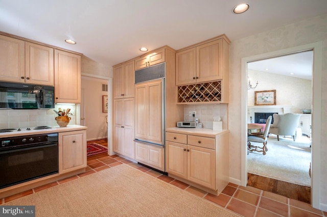 6501 Menlo Rd, Mclean, VA 22101 - kitchen with oven, black microwave, light brown cabinetry, paneled built in refrigerator, and recessed lighting