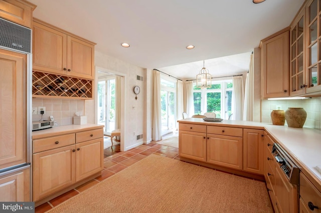 6501 Menlo Rd, Mclean, VA 22101 - kitchen with light brown cabinetry, decorative backsplash, light countertops, plenty of natural light, and recessed lighting