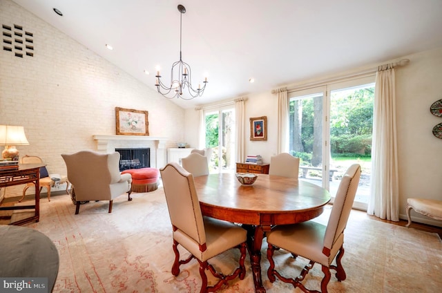 6501 Menlo Rd, Mclean, VA 22101 - dining area featuring a fireplace, a chandelier, high vaulted ceiling, and brick wall