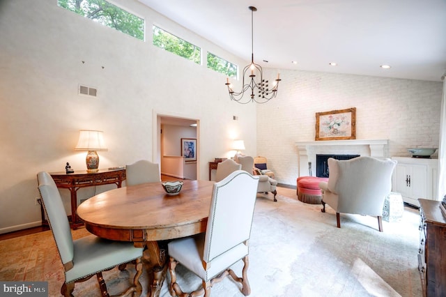 6501 Menlo Rd, Mclean, VA 22101 - dining space featuring a chandelier, high vaulted ceiling, and a fireplace