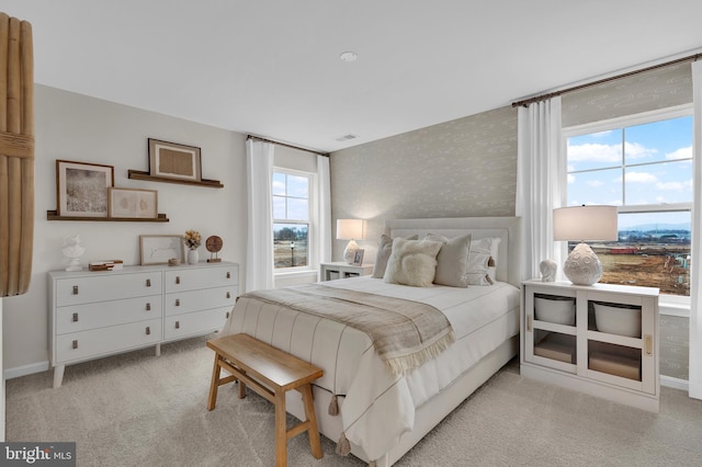 465 Hanson St, Frederick, MD 21701 - bedroom featuring multiple windows, light colored carpet, and wallpapered walls