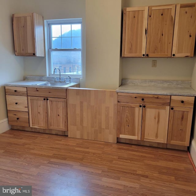89 S Mineral St, Keyser, WV 26726 - kitchen featuring a sink, light brown cabinets, light wood-style floors, and light countertops