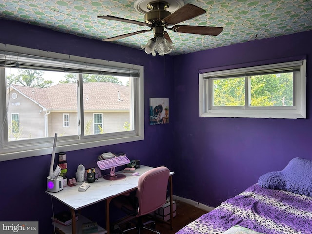 13012 Daley St, Silver Spring, MD 20906 - bedroom with multiple windows, a desk, baseboards, and wood finished floors