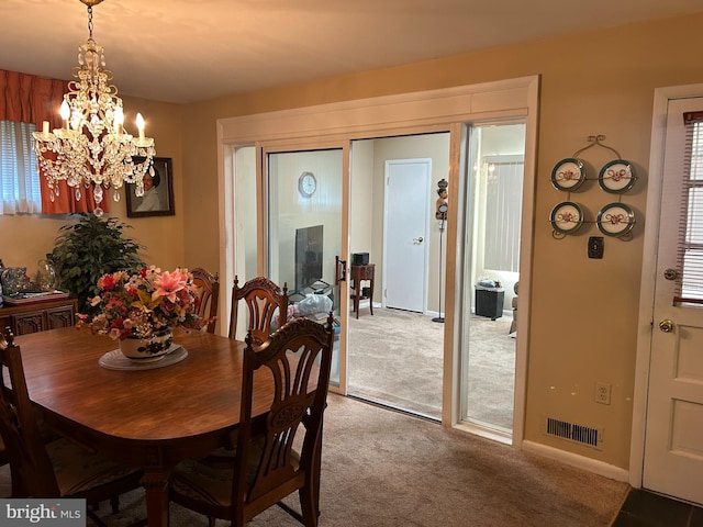 13012 Daley St, Silver Spring, MD 20906 - dining area featuring a chandelier, carpet floors, and baseboards
