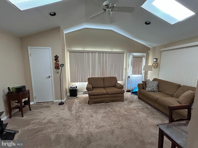 13012 Daley St, Silver Spring, MD 20906 - carpeted living area featuring lofted ceiling, a ceiling fan, a skylight, and baseboards