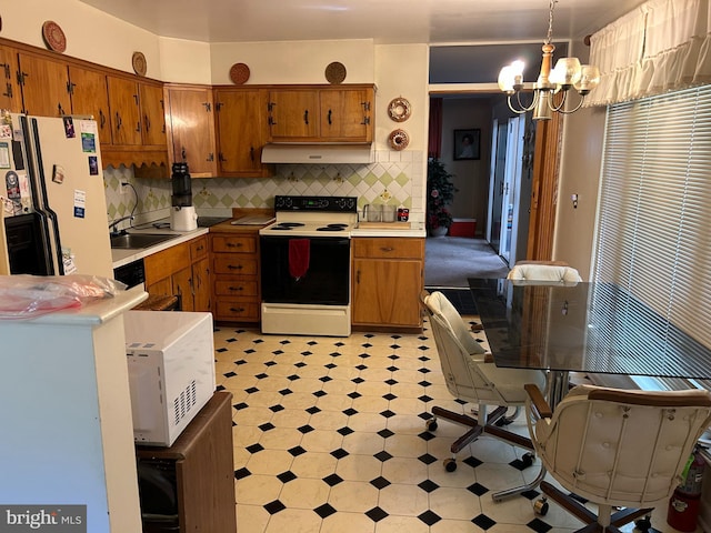 13012 Daley St, Silver Spring, MD 20906 - kitchen featuring white appliances, a sink, light countertops, light flooring, and brown cabinets