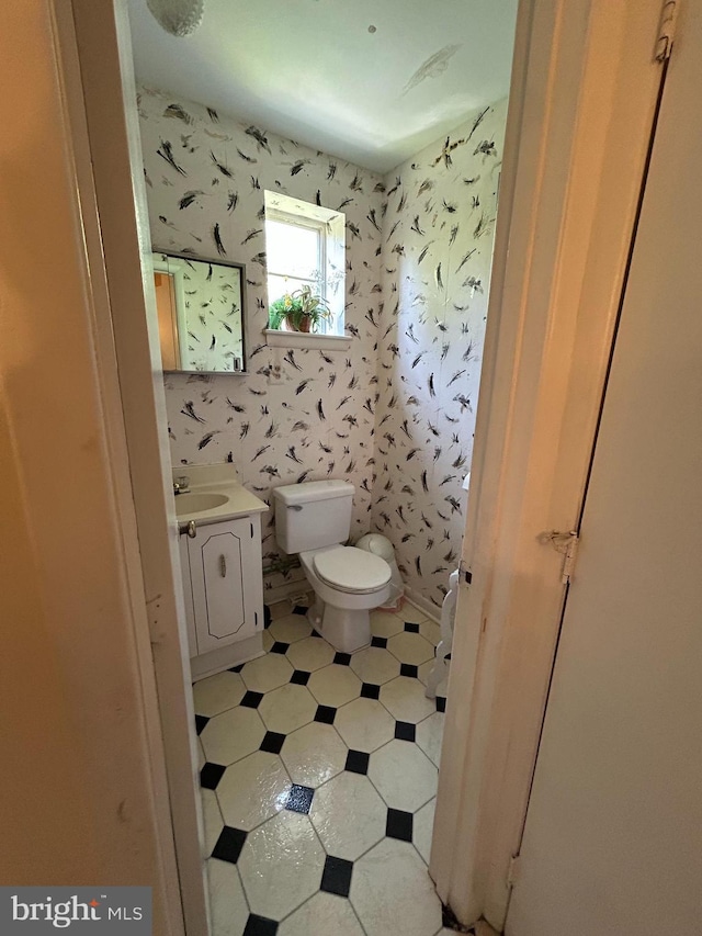 13012 Daley St, Silver Spring, MD 20906 - bathroom featuring vanity, toilet, and wallpapered walls
