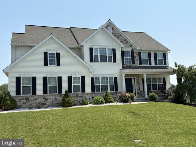 3 Rycroft Rd, Mechanicsburg, PA 17050 - view of front of home with stone siding, a front lawn, a porch, and roof with shingles