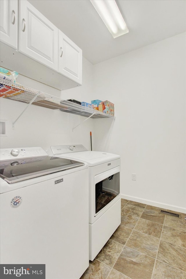 3 Rycroft Rd, Mechanicsburg, PA 17050 - laundry area with cabinet space, washing machine and clothes dryer, baseboards, and stone finish flooring