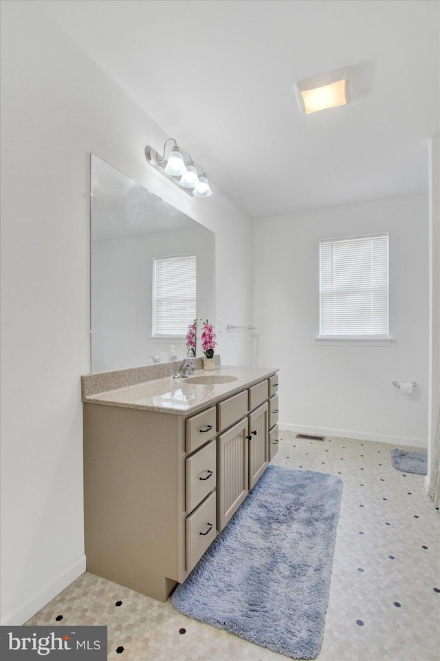 3 Rycroft Rd, Mechanicsburg, PA 17050 - bathroom with vanity, healthy amount of natural light, tile patterned floors, and baseboards