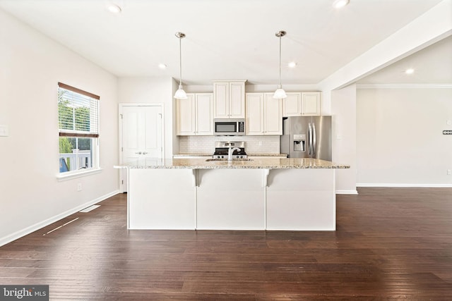 1307 Kohana Dr, Clarksboro, NJ 08020 - kitchen featuring appliances with stainless steel finishes, a sink, decorative backsplash, a kitchen island with sink, and dark wood-type flooring