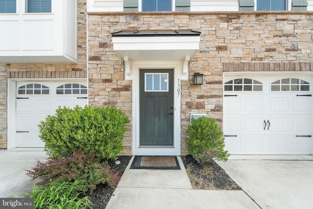 1307 Kohana Dr, Clarksboro, NJ 08020 - entrance to property featuring stone siding, a garage, and concrete driveway
