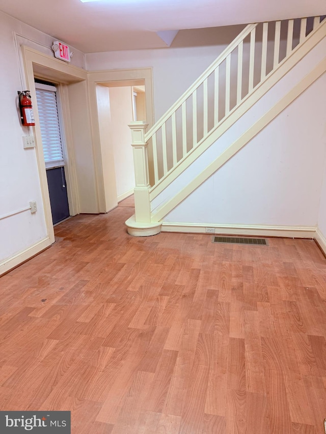 2410 Chichester Ave, Upper Chichester, PA 19061 - entryway with light wood-type flooring, baseboards, and stairs